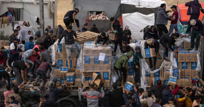 Palestinians Scramble for Aid as Supplies Parachute into Gaza