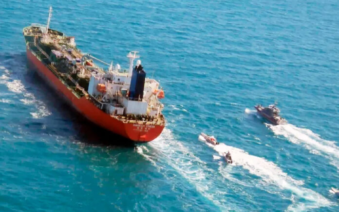 Dramatic Footage: Iran's IRGC Seizes 'Israeli-Linked' Ship Near Strait of Hormuz